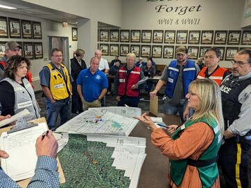 Marian Carlson, Regional Director of Emergency Management, addresses team members in an incident update briefing during the functional exercise.